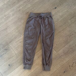 lululemon dance studio jogger in a mauve/tan color shows more grey in photo